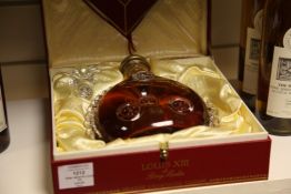 One bottle of Remy Martin Louis XIII, bottle no. Q6603. In red gift box with separate glass