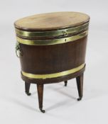 A George III brass bound mahogany cellaret, of oval form, on squared tapered legs, fitted brass