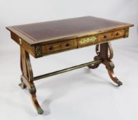 A Regency style rosewood banded mahogany library table, with red leather skiver and two frieze