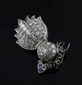 A gold, enamel and diamond set Royal artillery "flaming grenade" brooch, inscribed with motto "