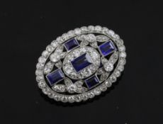 A 1930`s Art Deco white gold, sapphire and diamond set oval brooch, in Goldsmiths & Silversmiths