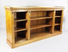 A Victorian birds eye maple dwarf open bookcase, with brass three quarter gallery and six adjustable