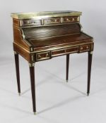 A Charles X brass mounted mahogany bureau de cylindre, with fitted interior and four drawers, on