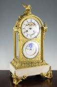 A 19th century French ormolu and white marble calendar mantel clock, surmounted with a bird and