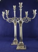 A pair of Victorian silver plated two branch, three light candelabra by Elkington & Co, with