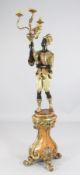 A Venetian 17th century style carved giltwood and polychrome Blackamoor four light torchere, the