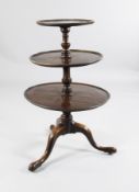 A George III mahogany graduated three tier dumb waiter, on tripod base, H.3ft 2.5in.