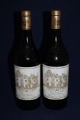 Two bottles of Chateau Haut-Brion 1995, Premier Cru Classe, Pessac-Leognan; very high fills, perfect