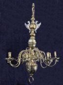 A 17th century Dutch style brass eight light chandelier, of traditional form with scroll branches