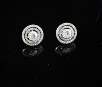 A pair of white gold and diamond set target earrings, with a total diamond weight of 1.32ct.