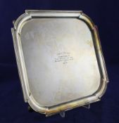 A George V silver salver with later Hove Club inscription, of square form with rounded corners and