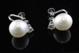 A pair of 9ct white gold, diamond and cultured pearl set ear clips.