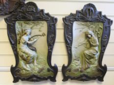 A pair of Johann Waresch Austrian Art Nouveau pottery wall plaques, depicting summer and winter,