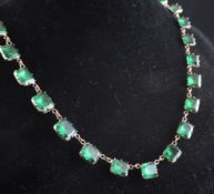 An early 19th century French gold, silver and green paste necklace, set with thirty four graduated