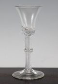 A George II airtwist wine glass, c.1745, the bell shaped bowl set on an airtwist stem with