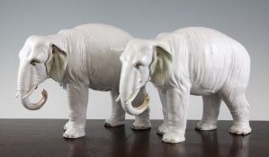 A pair of Continental porcelain figures of elephants, late 19th century, each modelled in standing