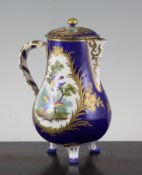 A Sevres style covered jug, 19th century, painted with fantastical birds in landscapes within rich