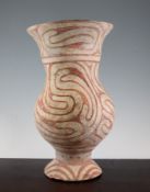 A Ban Chiang pottery vase, Thailand, c.3rd century BC., decorated in iron red with interlocking