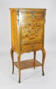 A Louis XV style kingwood and marquetry secretaire à abbatant, inlaid with a vase of flowers over