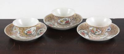 A set of three Chinese export famille rose teabowls and saucers, Yongzheng period, each painted with