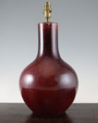 A Chinese sang de boeuf glazed bottle vase, 19th / 20th century, 13.75in. (35cm), neck reduced and