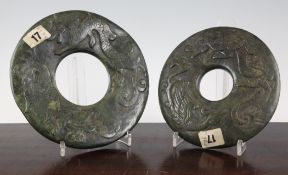 Two Chinese archaistic spinach green jade large bi discs, 20th century, each carved in relief with