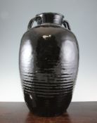 A large Henan black ware ovoid jar, probably Ming Dynasty, with four looped handles at the neck,