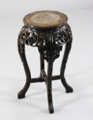 A 19th century Chinese hardwood vase stand, with marble inset top carved with bamboo, H.2ft.