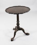A Victorian Chippendale style mahogany tea table, with tilting piecrust top, fluted stem and