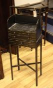 A Regency parcel gilt black painted chevret table, fitted four drawers, on squared legs, 1ft 4in.