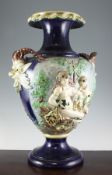 A large Palissy style faience vase, late 19th century, moulded in relief with bacchanalian figures