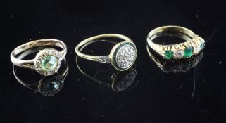 Two 18ct gold, emerald and diamond set rings, target and half hoop and a 15ct gold green paste and