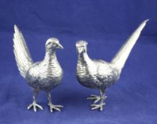 A pair of early 20th century Hanau silver free standings model of a cock and hen pheasants, with