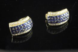 A stylish pair of 18ct gold, diamond and sapphire set earrings/clips, of demi lune form, 0.75in.