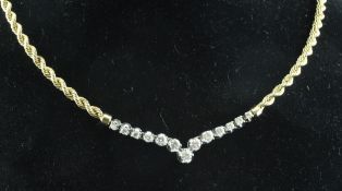 A 14ct gold rope twist necklace set with thirteen graduated diamonds in a white gold herringbone