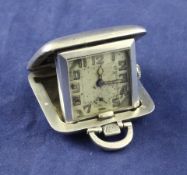 A George V engine turned silver cased travelling timepiece, of square form, with Arabic dial,