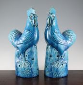 A pair of Chinese turquoise glazed models of cockerels, 20th century, standing on rock work bases,