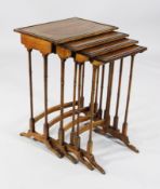 An Edwardian nest of mahogany quartetto tables, on ring turned columns and ebony strung feet, 1ft