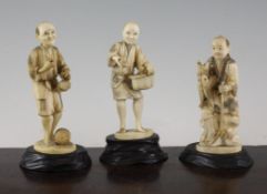 Three Japanese marine ivory okimonos, early 20th century, in the form of a street vendor, scribe and