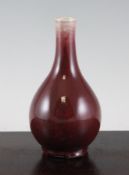 A Chinese sang de boeuf glazed small bottle vase, 18th/19th century, 6.3in. (16cm)