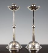 A pair of WMF silver plated candlesticks, with bowl shape drip pans, tapering square section