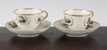 Two Swansea porcelain tea cups and saucers, c.1820, each piece painted with landscape vignettes