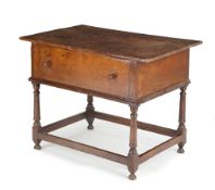 A George II oak box table, c.1740, the triple plank lift-off top above a deep dummy drawer, on