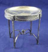 A George V silver miniature model of an occasional table, with dished top and frieze embossed with