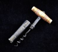 A Georgian silver travelling corkscrew, with ring turned ivory handle and spiral fluted helix cover,