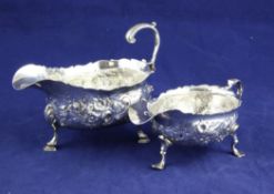 Two 18th century silver sauceboats, both with later embossed decoration, David Mowden, London, 1757?