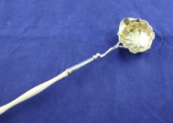 A George II silver punch ladle, with shaped ivory handle and bowl with later foliate embossed