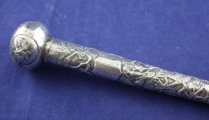 An early 20th century Chinese silver parasol handle, of tapering form, embossed with dragons,