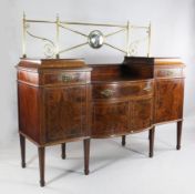 A 19th century mahogany floral marquetry inlaid drop centre sideboard, the raised brass railed