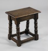 A 17th century style oak joynt stool, with turned underframe, 1ft 5in.